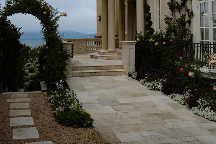 expert laying flagstone